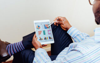 Man with data on a tablet - Percayso and MLP integration